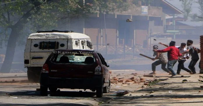 Youth pelting rocks on security forces after they resorted to tear shelling near Degree College Pulwama Youth pelting rocks on security forces after they resorted to tear shelling near Degree College Pulwama