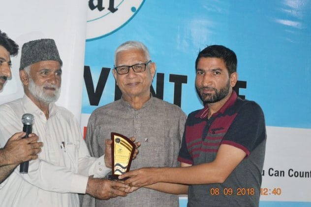 Radio Kashmir's Sports Correspondent, Muzaffar Dar presented with memento during the launch event