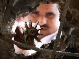 Villagers show shells fired on their village allegedly from Pakistan in R S Pura sector of Jammu and Kashmir