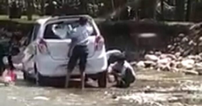 Teacher among two attached for making students wash their vehicles Teacher among two attached for making students wash their vehicles