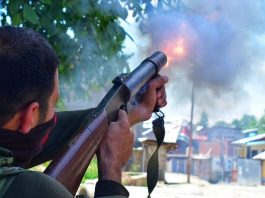 Government forces firing tear smoke shells during a protest in Kashmir