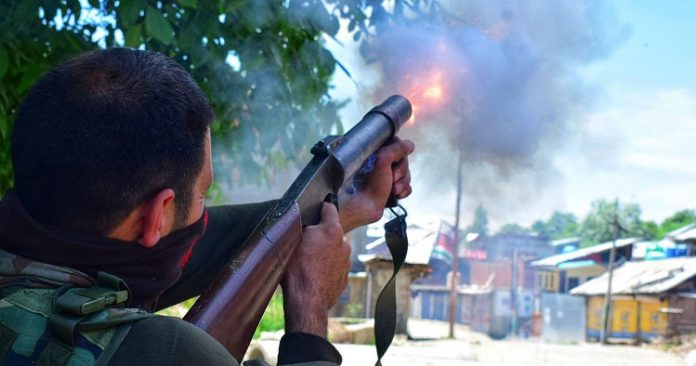Government forces firing tear smoke shells during a protest in Kashmir Government forces firing tear smoke shells during a protest in Kashmir