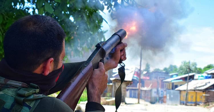 Government forces firing tear smoke shells during a protest in Kashmir