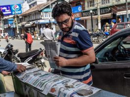 A newspaper vendor in Srinagar