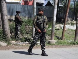 Army men stay guard during a gunfight in south Kashmir