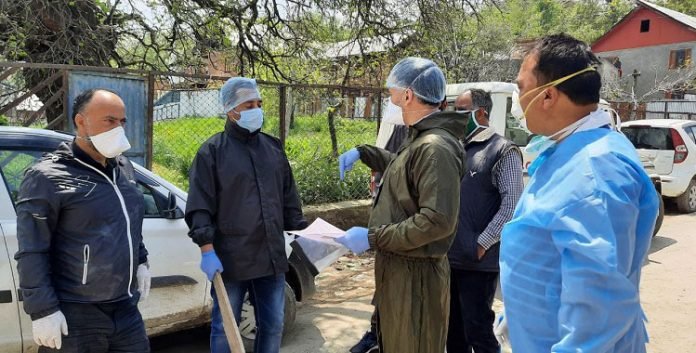 Medical team at Rahmoo Pulwama after COVID-19 case surfaced from the area