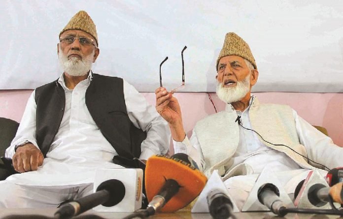 Mohammad Ashraf Sehrai with Syed Ali Geelani during a press conference Mohammad Ashraf Sehrai with Syed Ali Geelani during a press conference