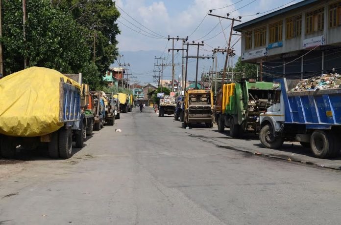 SMC trucks carrying waste in Srinagar city