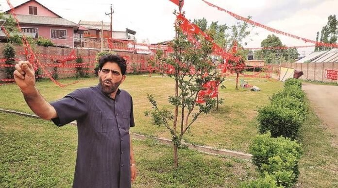 NC district chief Ghulam Mohidin Mir at the party office in Pulwama