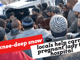 Pulwama - In knee-deep snow, locals help carry pregnant lady to hospital