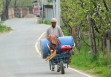 Only 42% of J&K’s net sown area under irrigation in 2023-24 With crops sprayer on his pushcart, a farmer heads towards his orchards.