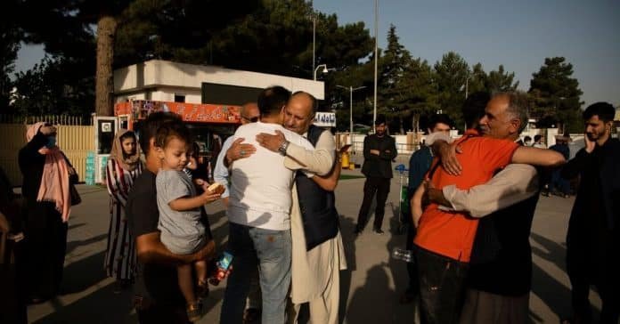 Families saying their goodbyes in the parking lot of the airport in Kabul Families saying their goodbyes in the parking lot of the airport in Kabul