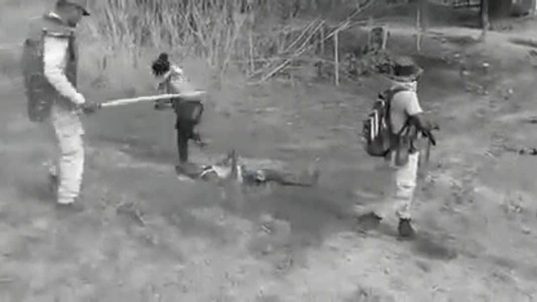 Photographer beating a civilian during violence in Assam