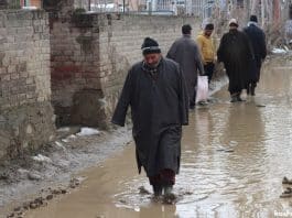 Waterlogging after snowfall adds to woes of commuters in Parigam village