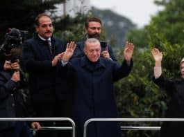 Turkish President Recep Tayyip Erdogan gestures as he addresses his supporters following early exit poll results for the second round of the presidential election in Istanbul on May 28, 2023
