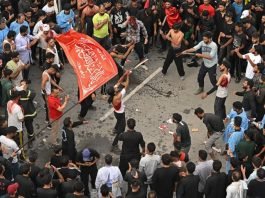 Mourners take part in a Muharram procession in Srinagar