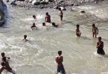 16 parks at tourist hotspots reopen in Kashmir Children taking bath to beat the heat in a canal in south Kashmir's Pahalgam area