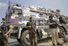 J&K Police conduct searches for banned literature in Poonch bookshops Crisis Response Team (CRT) stand near command vehicle of J&K Police in Jammu