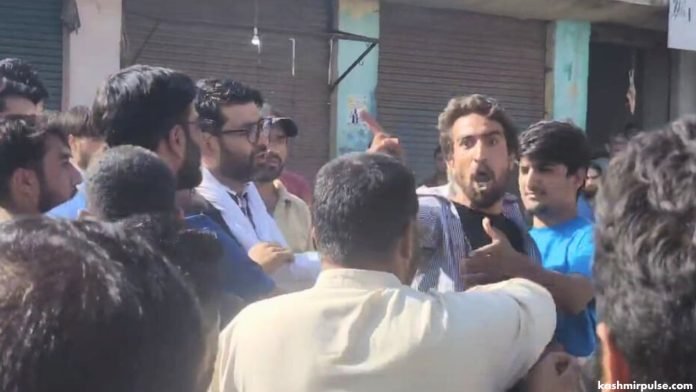 BJP leader Arshad Bhat along with his party workers protest outside polling station in Bellow village of Pulwama BJP leader Arshad Bhat along with his party workers protest outside polling station in Bellow village of Pulwama