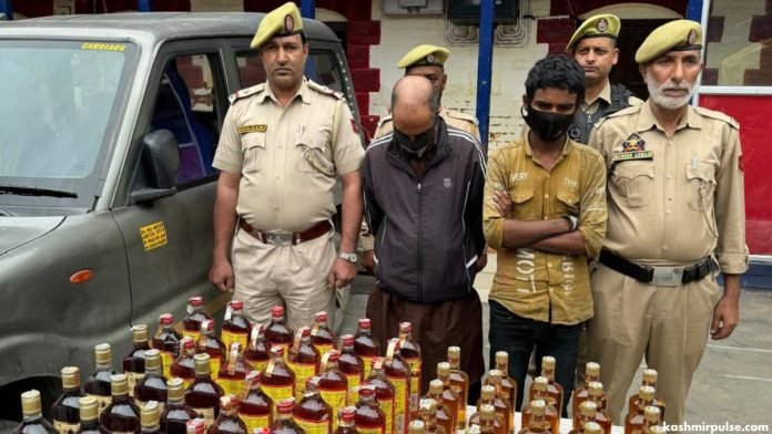 Pulwama Police arrest two, seize 70 bottles of liquor Pulwama Police arrest two, seize 70 bottles of liquor