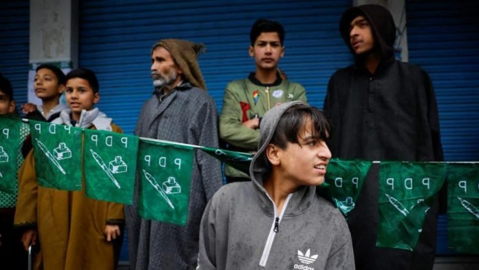 Supporters attend a roadshow by Mehbooba Mufti at an election campaign rally Supporters attend a roadshow by Mehbooba Mufti at an election campaign rally