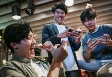 Win and Earn Big with These Real Cash Games for Android Users A group of youth playing real cash games on their mobile phones