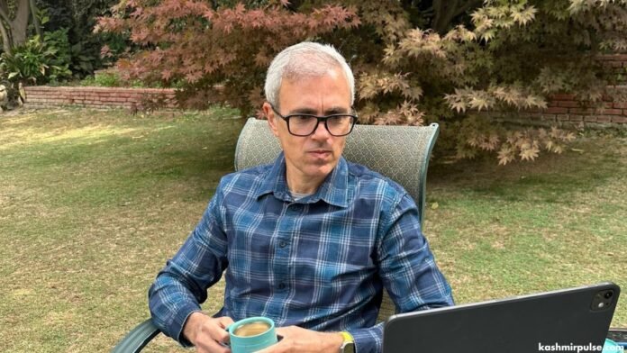 Omar Abdullah sitting in the lawn of his Gupkar residence