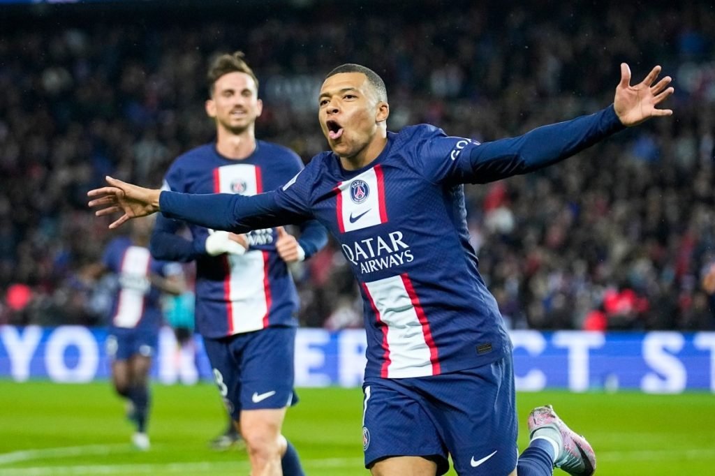 PSG's Kylian Mbappe celebrates scoring his side's opening goal during the French League One soccer match between Paris Saint Germain and Lens at Parc des Princes stadium in Paris, France, Saturday, April 15, 2023