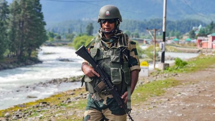 A BSF person stands guard in Pahalgam