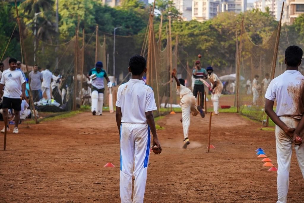 Young boys practice in the nets during a practice session