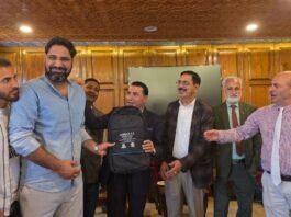 Nazir A. Ganaie accepts a token of appreciation at a recent event