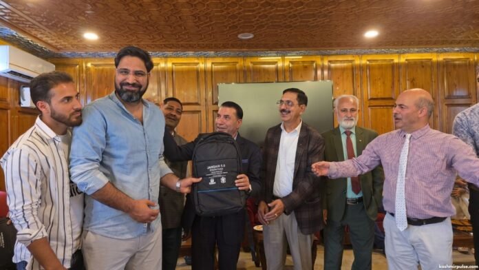 Nazir A. Ganaie accepts a token of appreciation at a recent event Nazir A. Ganaie accepts a token of appreciation at a recent event