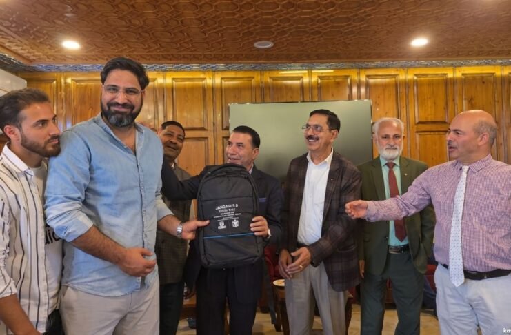Nazir A. Ganaie accepts a token of appreciation at a recent event