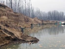 Damage to protective embankments due to illegal sand mining in Pampore