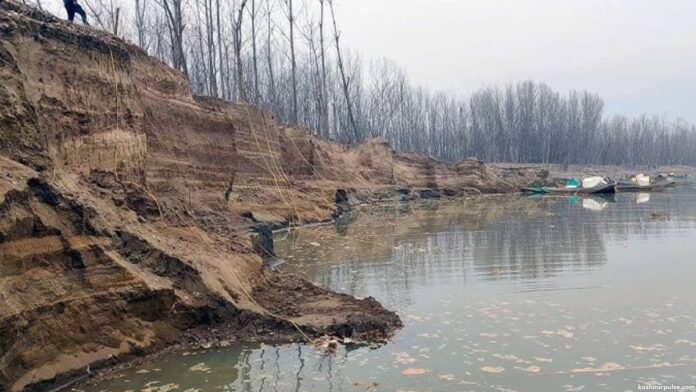 Damage to protective embankments due to illegal sand mining in Pampore