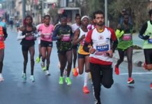 Kenyan runners win Kashmir Marathon titles; Runner carrying child draws attention Kenyan runners win Kashmir Marathon titles