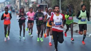 Kenyan runners win Kashmir Marathon titles; Runner carrying child draws attention
